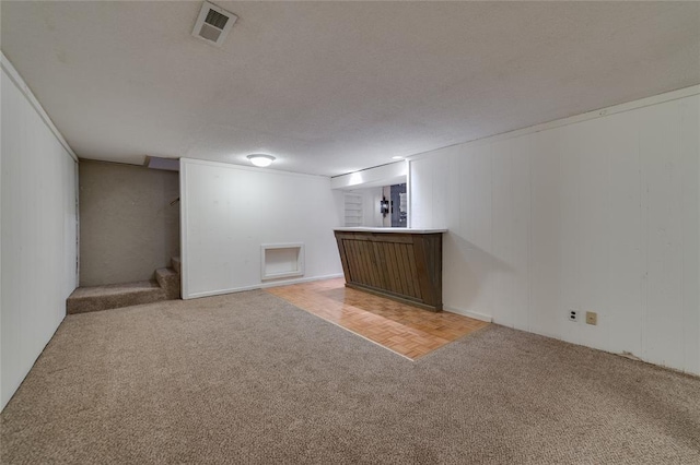 204 Chestnut Dr, Saint Charles, MO 63301 - finished basement featuring light carpet, stairs, and bar area