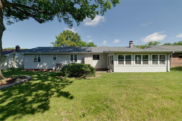204 Chestnut Dr, Saint Charles, MO 63301 - rear view of property featuring a chimney and a lawn