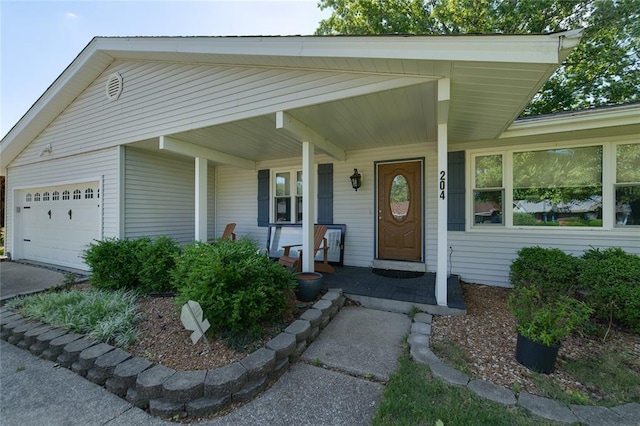 204 Chestnut Dr, Saint Charles, MO 63301 - entrance to property with an attached garage and covered porch