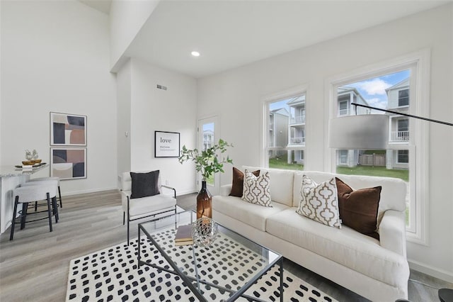 4001 Marais Temps Clair Dr, Saint Charles, MO 63304 - living room with light wood-style floors, baseboards, and recessed lighting