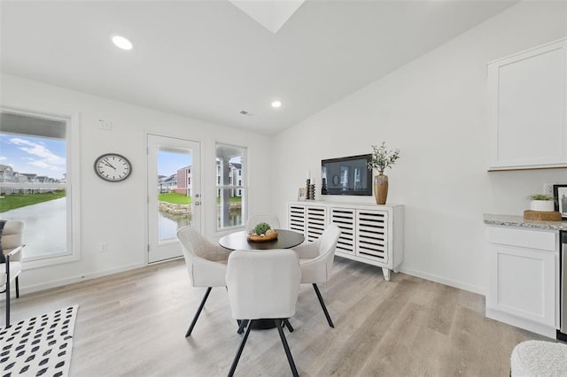4001 Marais Temps Clair Dr, Saint Charles, MO 63304 - dining room featuring vaulted ceiling, light wood finished floors, baseboards, and recessed lighting