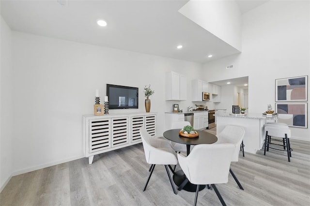 4001 Marais Temps Clair Dr, Saint Charles, MO 63304 - dining space featuring light wood-type flooring, baseboards, and recessed lighting