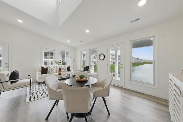 4001 Marais Temps Clair Dr, Saint Charles, MO 63304 - dining room featuring healthy amount of natural light, light wood-style floors, vaulted ceiling, recessed lighting, and baseboards