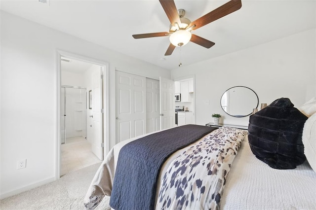 4001 Marais Temps Clair Dr, Saint Charles, MO 63304 - bedroom with light carpet, ensuite bath, a closet, baseboards, and ceiling fan