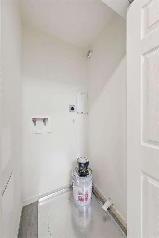 4001 Marais Temps Clair Dr, Saint Charles, MO 63304 - laundry room with electric dryer hookup, washer hookup, baseboards, and wood finished floors