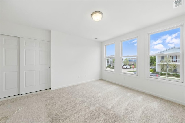 4001 Marais Temps Clair Dr, Saint Charles, MO 63304 - unfurnished bedroom featuring baseboards, carpet flooring, and a closet