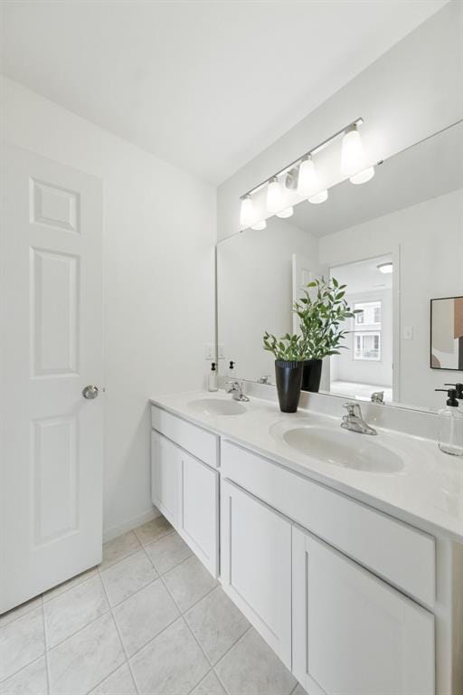 4001 Marais Temps Clair Dr, Saint Charles, MO 63304 - bathroom featuring double vanity and tile patterned flooring
