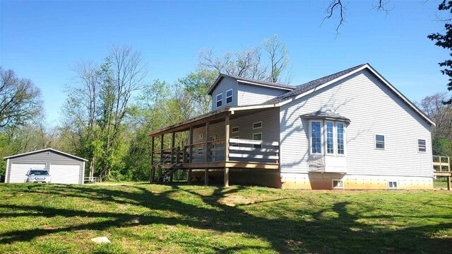 2357 Pine St, Centerville, MO 63633 - view of side of home with a garage, a lawn, a wooden deck, and an outdoor structure