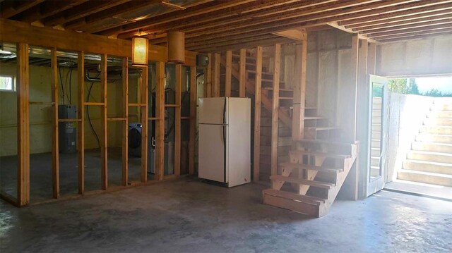 2357 Pine St, Centerville, MO 63633 - basement with freestanding refrigerator, water heater, and stairs
