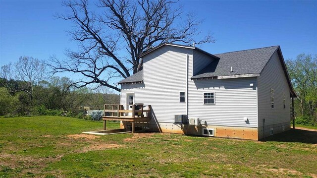 2357 Pine St, Centerville, MO 63633 - rear view of house with a shingled roof, a wooden deck, and a yard
