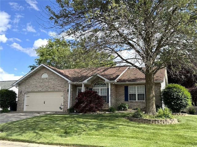 113 Fairway Dr, Maryville, IL 62062 - ranch-style home with brick siding, an attached garage, driveway, and a front lawn