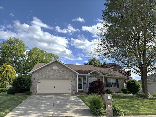 113 Fairway Dr, Maryville, IL 62062 - single story home with concrete driveway, a garage, brick siding, and a front yard