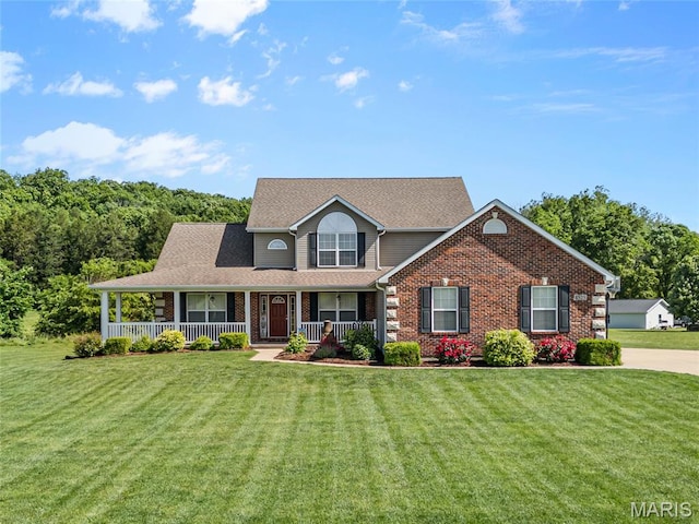 8525 Sagamore Dr, Cedar Hill, MO 63016 - view of front of property featuring covered porch, a front lawn, and brick siding