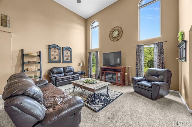 8525 Sagamore Dr, Cedar Hill, MO 63016 - living room with high vaulted ceiling, carpet, and a ceiling fan
