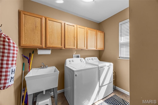 8525 Sagamore Dr, Cedar Hill, MO 63016 - washroom featuring separate washer and dryer, cabinet space, and dark tile patterned flooring