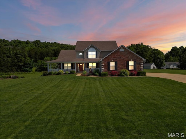 8525 Sagamore Dr, Cedar Hill, MO 63016 - view of front facade with a porch, a front lawn, and concrete driveway