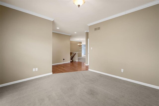 734 River Glen Dr, Ofallon, MO 63368 - spare room featuring crown molding, carpet, baseboards, a chandelier, and recessed lighting