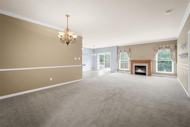 734 River Glen Dr, Ofallon, MO 63368 - unfurnished living room with ornamental molding, a chandelier, carpet, a fireplace with flush hearth, and baseboards