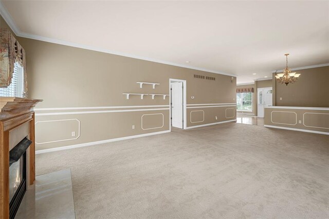 734 River Glen Dr, Ofallon, MO 63368 - unfurnished living room with a chandelier, a fireplace, ornamental molding, and carpet floors