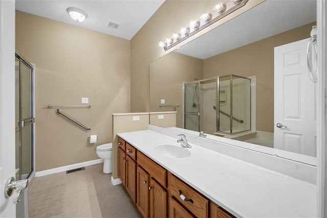 734 River Glen Dr, Ofallon, MO 63368 - bathroom featuring vanity, a stall shower, toilet, baseboards, and tile patterned flooring