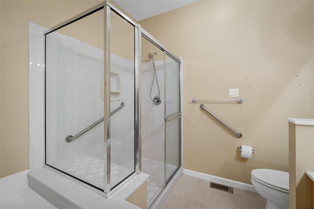 734 River Glen Dr, Ofallon, MO 63368 - full bathroom featuring toilet, a shower stall, vanity, tile patterned flooring, and baseboards