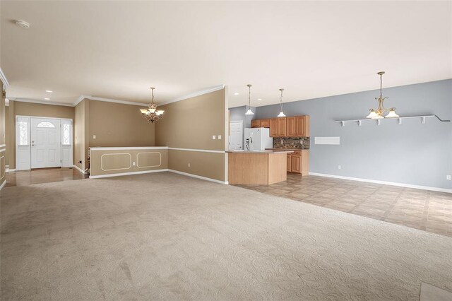 734 River Glen Dr, Ofallon, MO 63368 - unfurnished living room with a chandelier, baseboards, ornamental molding, light colored carpet, and recessed lighting