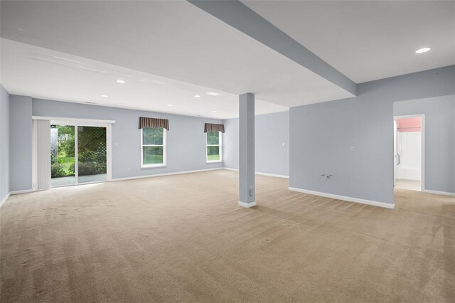 734 River Glen Dr, Ofallon, MO 63368 - unfurnished living room featuring light carpet, baseboards, recessed lighting, and healthy amount of natural light