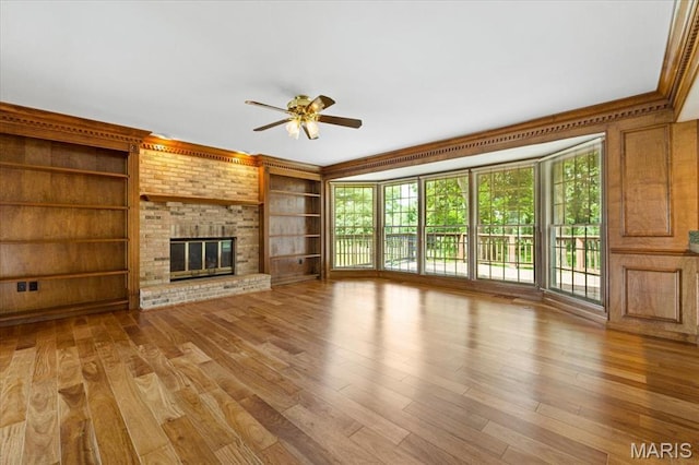 767 Carman Meadows Dr S, Manchester, MO 63021 - unfurnished living room with ceiling fan, wood finished floors, and plenty of natural light