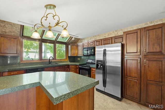 767 Carman Meadows Dr S, Manchester, MO 63021 - kitchen with black appliances, light tile patterned floors, decorative backsplash, decorative light fixtures, and brown cabinetry