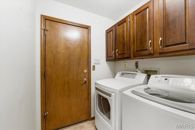 767 Carman Meadows Dr S, Manchester, MO 63021 - laundry area featuring washer and clothes dryer and cabinet space