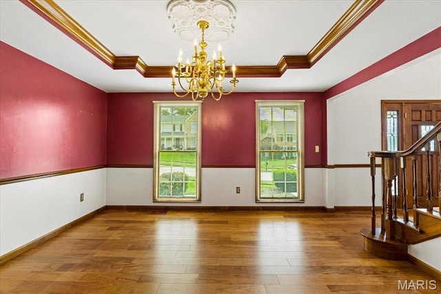 767 Carman Meadows Dr S, Manchester, MO 63021 - unfurnished dining area featuring a raised ceiling, a chandelier, plenty of natural light, and crown molding