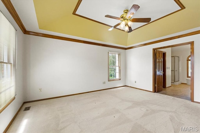 767 Carman Meadows Dr S, Manchester, MO 63021 - empty room featuring light colored carpet, ceiling fan, crown molding, and a tray ceiling