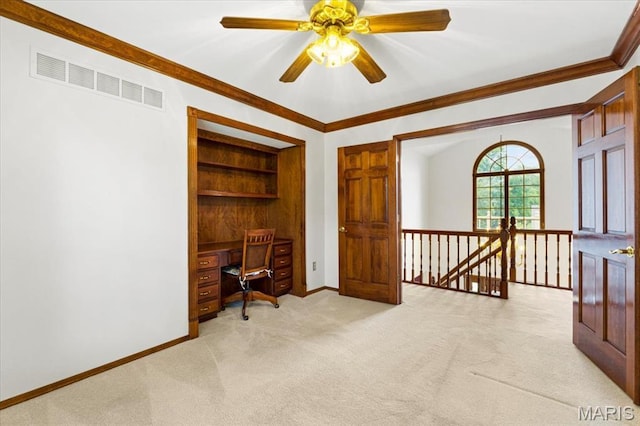 767 Carman Meadows Dr S, Manchester, MO 63021 - office featuring light colored carpet, built in desk, crown molding, a ceiling fan, and built in shelves