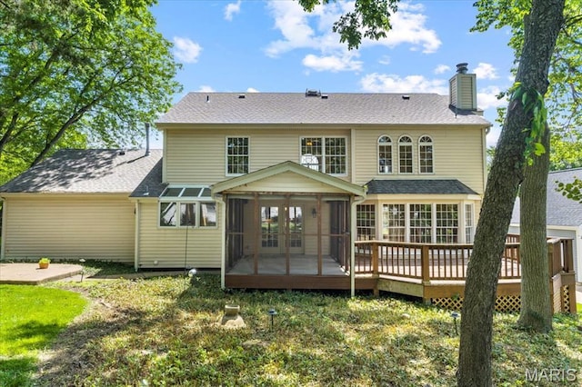 767 Carman Meadows Dr S, Manchester, MO 63021 - back of property featuring a sunroom, french doors, a chimney, a deck, and a shingled roof