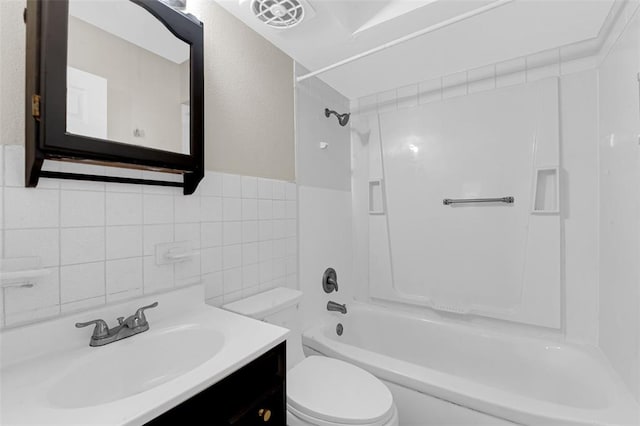 655 5th Plz, Florissant, MO 63031 - full bathroom featuring toilet, shower / tub combination, tile walls, and vanity