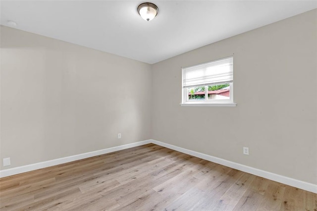 655 5th Plz, Florissant, MO 63031 - unfurnished room with wood finished floors and baseboards