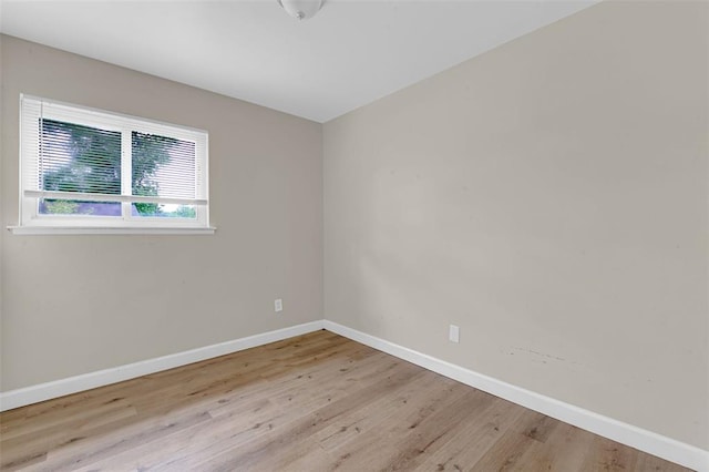 655 5th Plz, Florissant, MO 63031 - unfurnished room featuring baseboards and wood finished floors