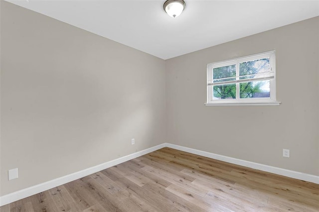 655 5th Plz, Florissant, MO 63031 - unfurnished room with light wood-style floors and baseboards
