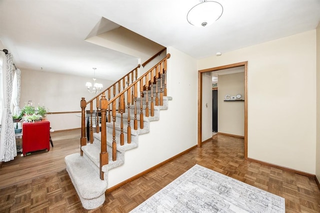 14 Shallowbrook Dr, Ofallon, IL 62269 - stairway with baseboards and a chandelier