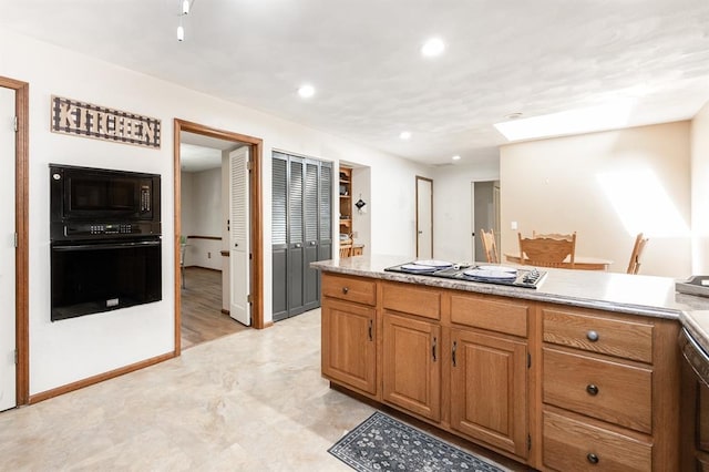 14 Shallowbrook Dr, Ofallon, IL 62269 - kitchen with black appliances, light countertops, recessed lighting, brown cabinets, and baseboards