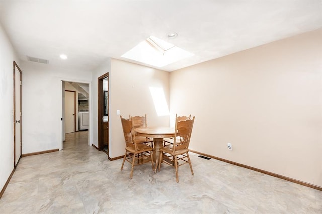 14 Shallowbrook Dr, Ofallon, IL 62269 - dining area with a skylight, washer / clothes dryer, baseboards, recessed lighting, and light floors