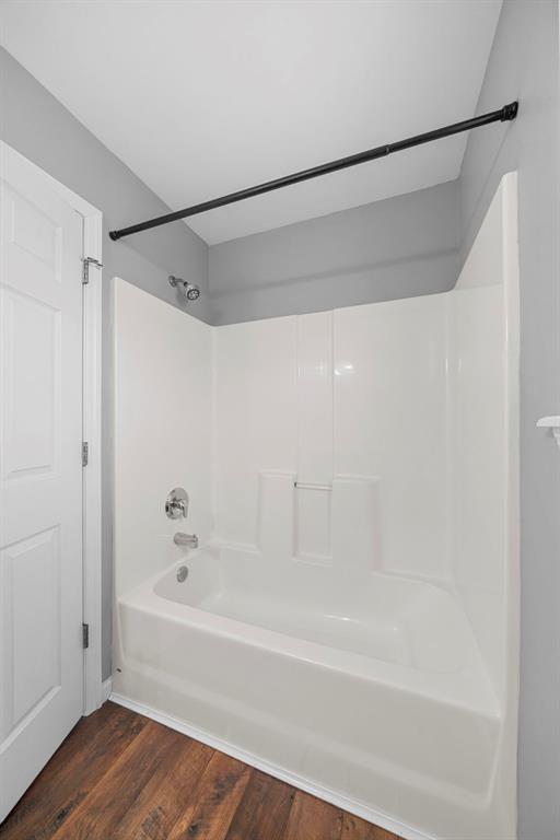 433 Fawn Run Dr, Troy, MO 63379 - full bathroom featuring wood finished floors and washtub / shower combination