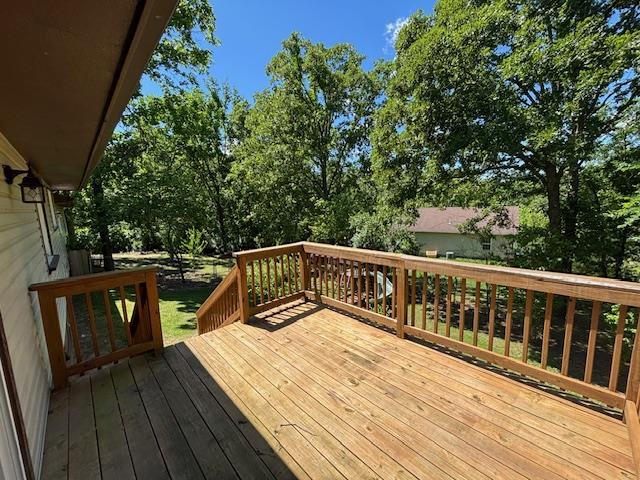 201 Penelope Pl, Olympian Village, MO 63020 - deck featuring view of wooded area