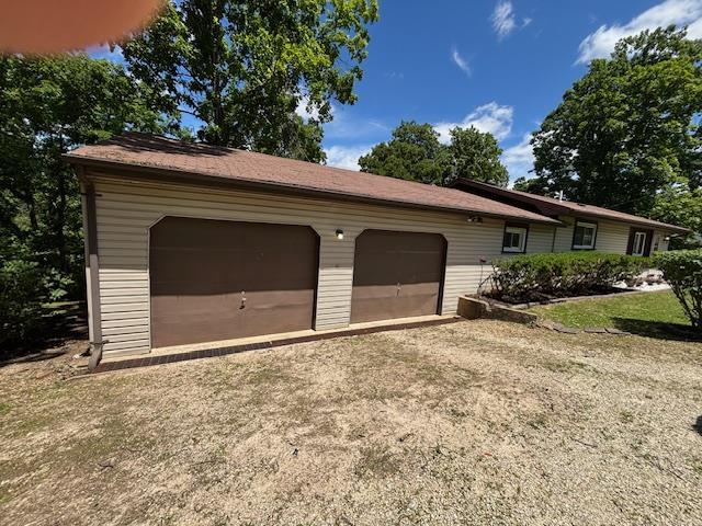 201 Penelope Pl, Olympian Village, MO 63020 - garage featuring driveway