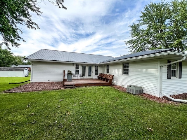 619 Cleveland St, Paris, MO 65275 - back of house with a wooden deck, central AC, a yard, and metal roof