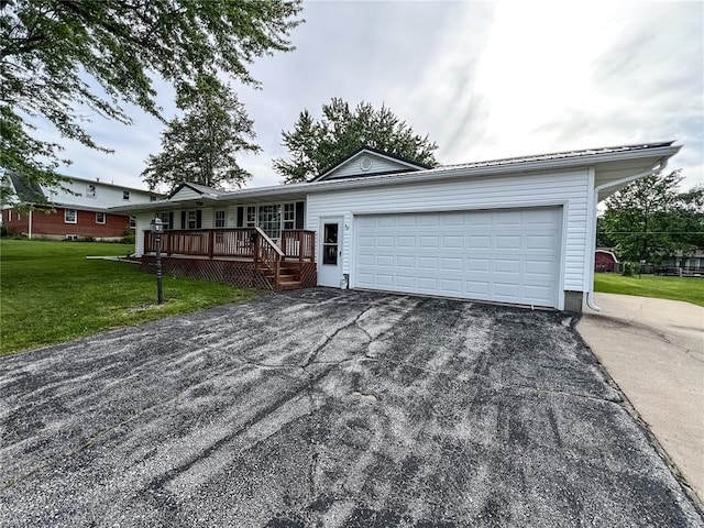 619 Cleveland St, Paris, MO 65275 - ranch-style house with asphalt driveway, a front lawn, a garage, and a porch