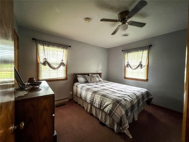 619 Cleveland St, Paris, MO 65275 - carpeted bedroom featuring baseboard heating and ceiling fan
