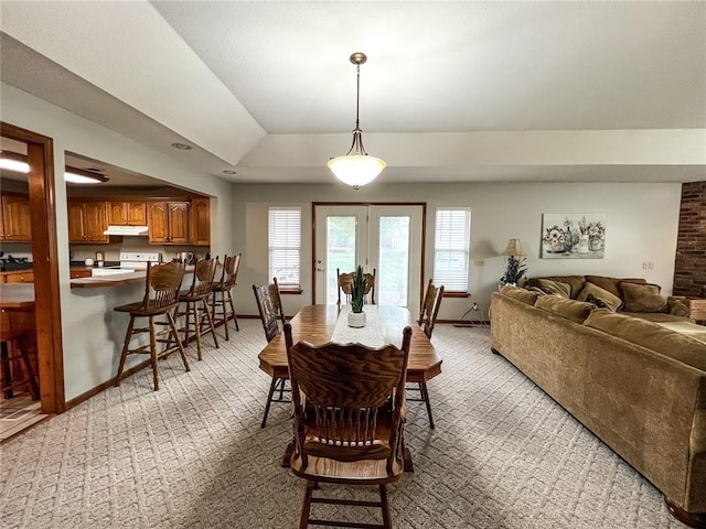 619 Cleveland St, Paris, MO 65275 - dining space featuring light carpet, baseboards, french doors, and lofted ceiling