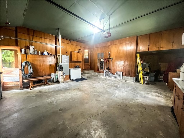 619 Cleveland St, Paris, MO 65275 - garage featuring wooden walls and a garage door opener