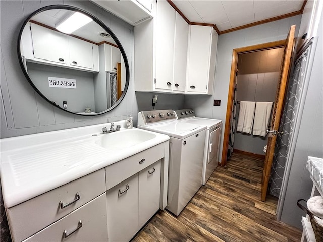 619 Cleveland St, Paris, MO 65275 - laundry room with cabinet space, washer and dryer, dark wood-style floors, and crown molding